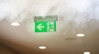 Evacuating sign in office builging while fire